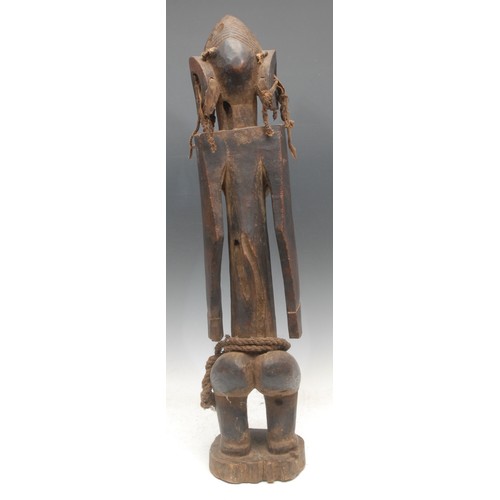 63 - Tribal Art - a Mumuye female figure, of typical elongated proportions, stylised features, cord and f... 