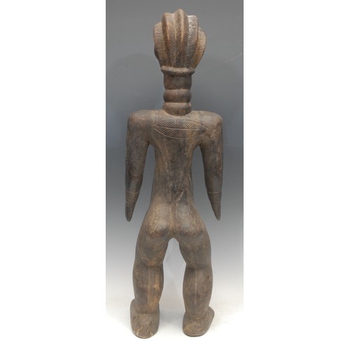 19 - Tribal Art - a Dan female figure, she stands, with elongated neck, metal teeth, 66cm high, Ivory Coa... 