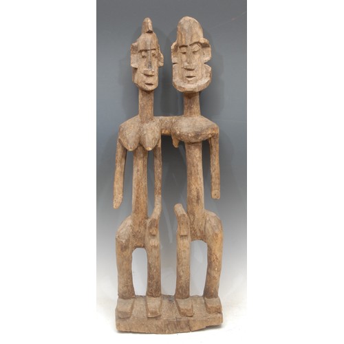 22 - Tribal Art - a Dogon figural carving, depicting the primordial couple, 59cm high, Mali, West Africa