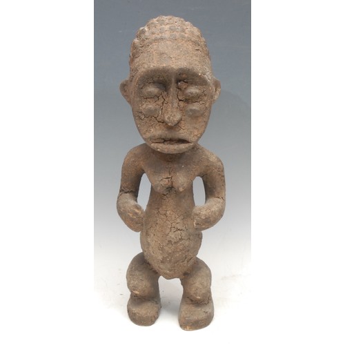 57 - Tribal Art - a Mambilla tadep figure, typically carved and posed, 42cm high, Cameroon