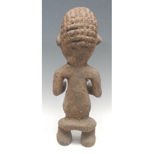 57 - Tribal Art - a Mambilla tadep figure, typically carved and posed, 42cm high, Cameroon