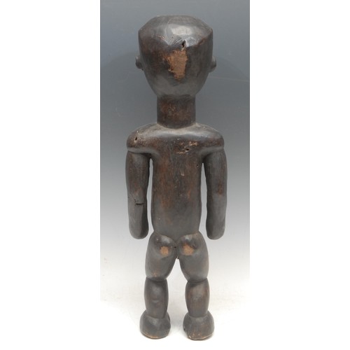 100 - Tribal Art - an African reliquary power figure, probably Fang, depicted standing, the elongated body... 