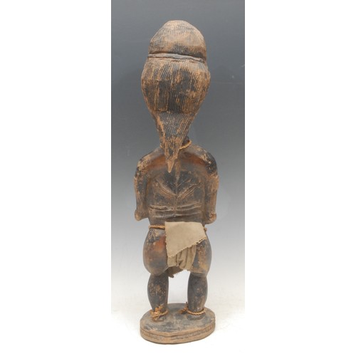 8 - Tribal Art - a Baule female figure, elaborate coiffure, scarified, 49cm high, Ivory Coast