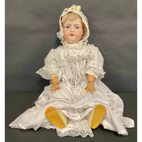 5552 - An Armand & Marseille bisque head and painted composition doll, the painted bisque head inset with w... 