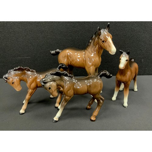 16 - A group of four Beswick brown foals, no.947, others, marks to base, (4).