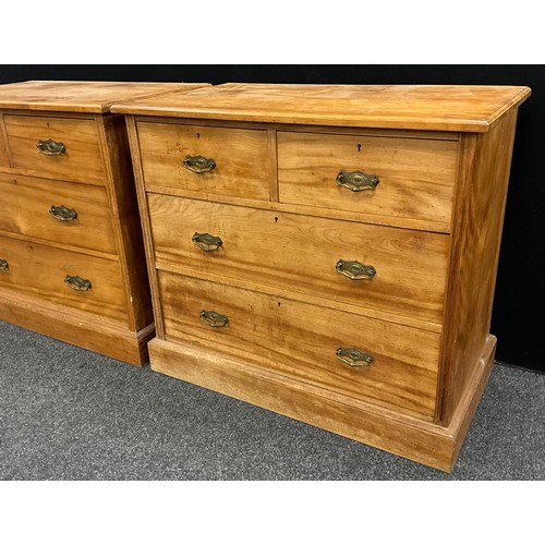 52 - A Pair of Edwardian satinwood chests of drawers, each with two short, over two long drawers, (brass ... 