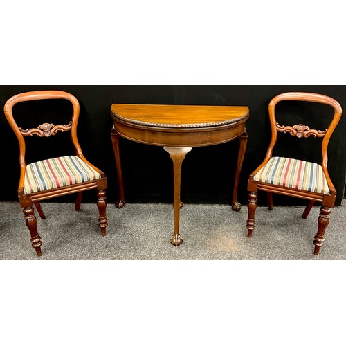 86 - A pair of Victorian mahogany balloon-back chairs, and a reproduction mahogany Demi-lune card table, ... 