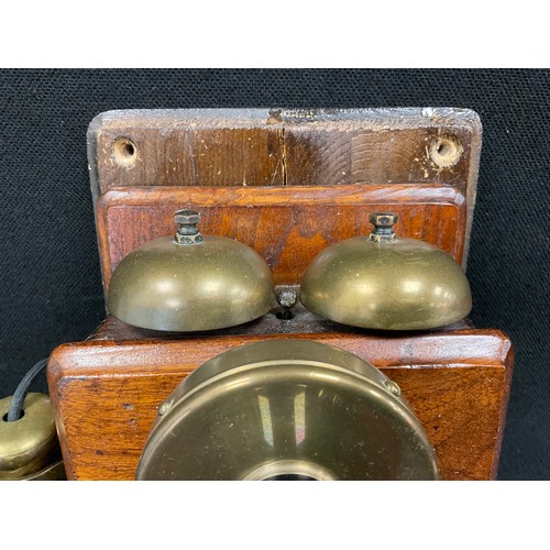 89 - An early 20th century mahogany cased wall mounted telephone.