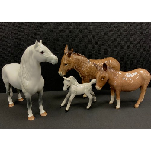 110 - Beswick animals including; Welsh mountain pony, no.1643 conforming dapple foal, two Donkeys, marks t... 