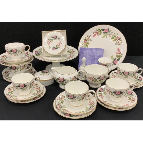 124 - Wedgwood Hathaway Rose pattern including; six tea cup and saucers, milk jug, sugar bowl, bell, trink... 