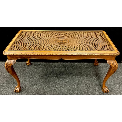 230 - A walnut coffee table, with bergere weave and glazed top, carved cabriole legs, with ball-and-claw f... 