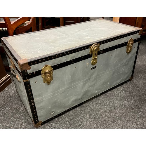 191A - A Vintage metal travelling trunk, by Mossman, of London, 50.5cm high x 101cm wide x 51.5cm deep.