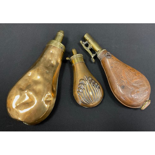 293 - A Sykes patent copper and brass four level powder flask, another smaller single pour, a G & J W Hawk... 