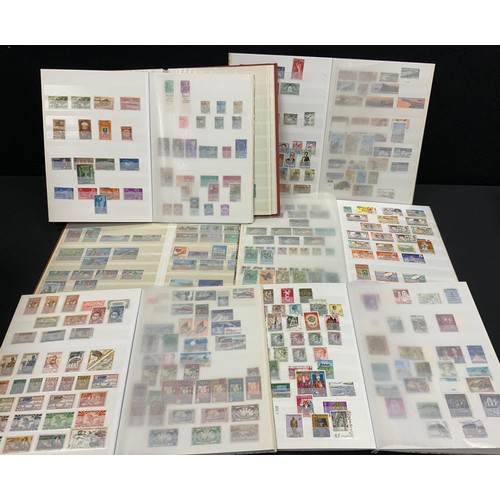 302 - Stamps - seven stamp albums, various countries, SWA, Swaziland, Tuvalu, French Colonies, Zambia, etc... 