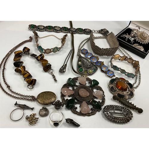 305 - Jewellery  - Victorian silver.  Scottish Cairngorm kilt brooch with bloodstone sections; Horse and F... 