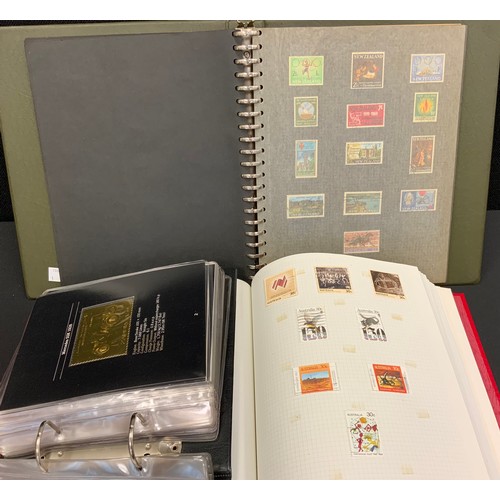 313 - Stamps - three stamp albums, one Australia, one New Zealand, one 25 Classic Cars from Zambia in 22ct... 