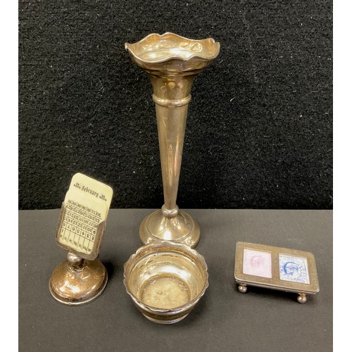 319 - An Edwardian silver table salt, Birmingham 1901;  desk calendar, marks worn;  stamp case, Sheffield ... 
