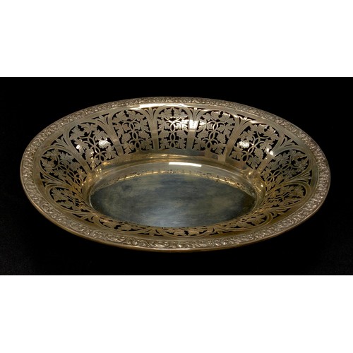 332 - An Austrian oval bread dish, decorated with a pierced border of grapevines, Austrian, c.1925, 28cm w... 