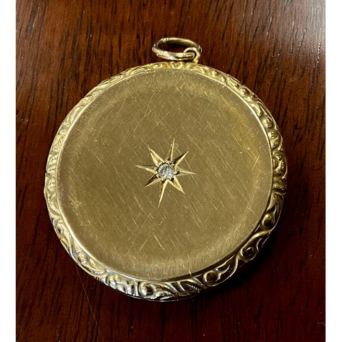 416 - A diamond accented circular 9ct gold locket, approx. 0.08ct, Birmingham 1967, 31mm diameter, 8g gros... 