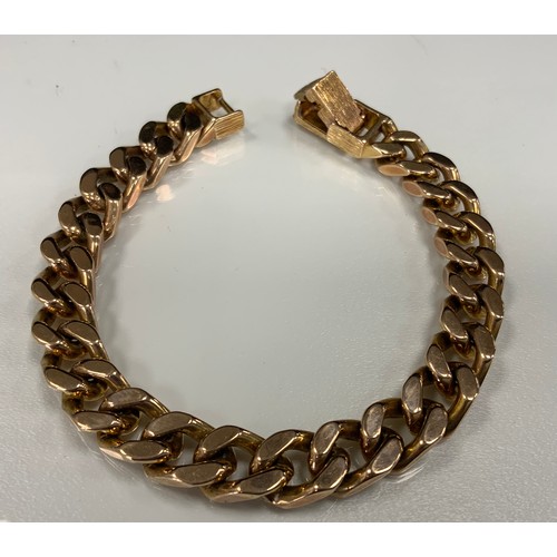 420 - A 9ct gold heavy weight curb link bracelet, 20cm long, 1.1cm wide, 51.2g