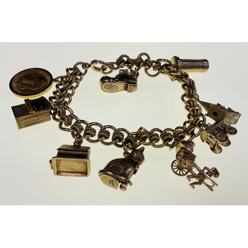 452 - Fancy link 9g gold charm bracelet, suspending 1913 half sovereign.  8 assorted charms in Punch and J... 