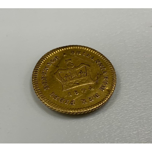 462 - A George III 1804 third of a Guinea gold coin, raised edge, 2.7g