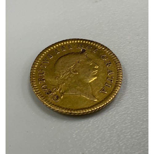 462 - A George III 1804 third of a Guinea gold coin, raised edge, 2.7g