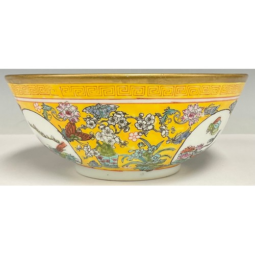 47 - A Republic period Chinese fruit bowl, decorated in the famille rose tradition on a yellow ground, ru... 