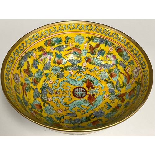 47 - A Republic period Chinese fruit bowl, decorated in the famille rose tradition on a yellow ground, ru... 