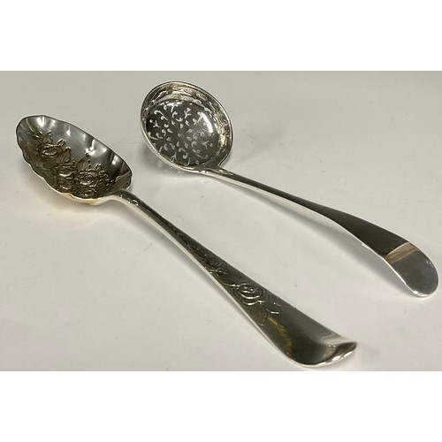 59 - A George III silver embossed berry spoon, 20.5cm long, Birmingham, indistinctly dated; a Victorian s... 