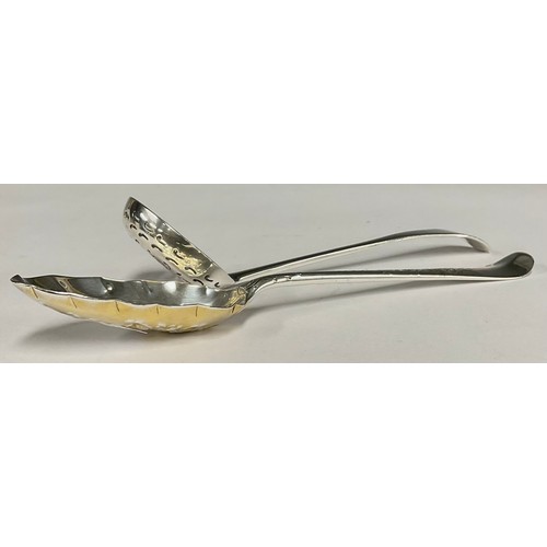 59 - A George III silver embossed berry spoon, 20.5cm long, Birmingham, indistinctly dated; a Victorian s... 