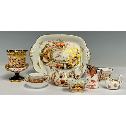130 - Ceramics - a Royal Crown Derby 2451 Imari pattern miniature cabaret tea service, comprising tea pot,... 