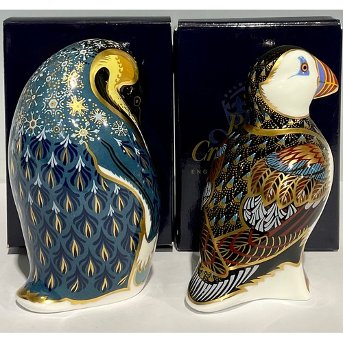 306 - A Royal Crown Derby paperweight, Penguin and Chick, gold stopper, boxed; another, Puffin, gold stopp... 