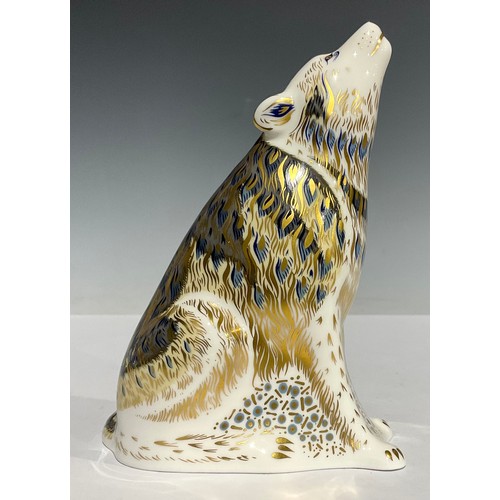 4 - A Royal Crown Derby paperweight, Wolf, 13cm high, printed marks in red, gold stopper