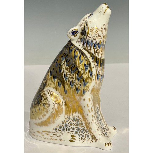 4 - A Royal Crown Derby paperweight, Wolf, 13cm high, printed marks in red, gold stopper