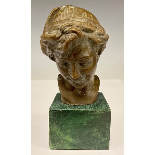331 - A bronzed metal bust, Boy with cloth cap, green stone plinth, 13.5cm high