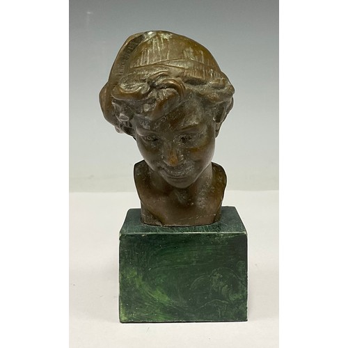 331 - A bronzed metal bust, Boy with cloth cap, green stone plinth, 13.5cm high