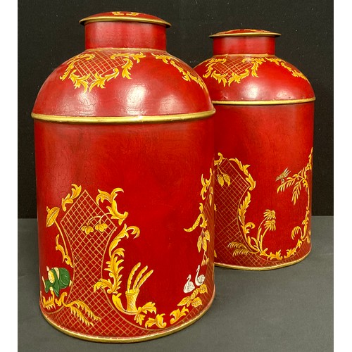 333 - A pair of reproduction red toleware style tea canisters painted with chinoiserie style decoration, 3... 