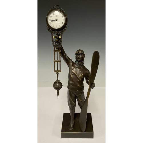 337 - A bronzed metal mystery clock modelled as an aviator, approx. 38.5cm high