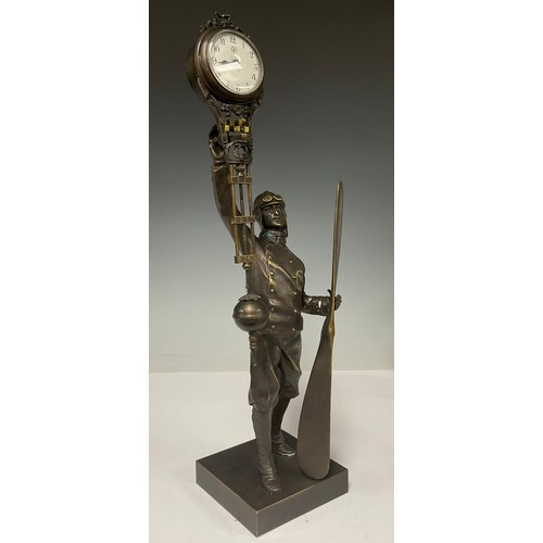 337 - A bronzed metal mystery clock modelled as an aviator, approx. 38.5cm high
