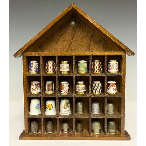338 - A collection of twelve Royal Crown Derby thimbles; twelve others