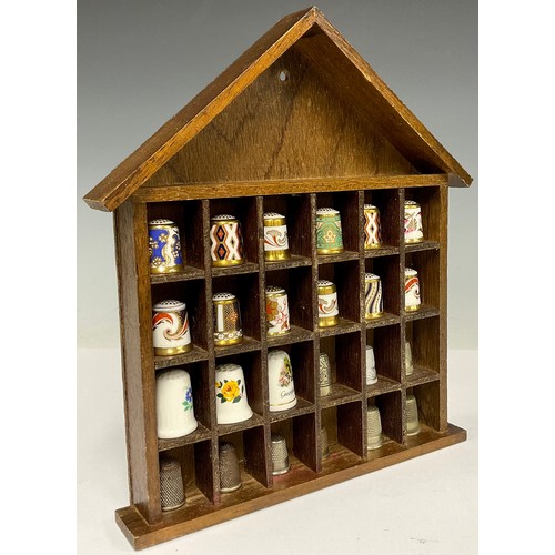 338 - A collection of twelve Royal Crown Derby thimbles; twelve others
