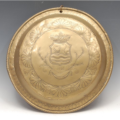 349 - A Dutch brass dairy bowl, chased to verso with the arms of Zeeland and bearing date of 1731, 38cm di... 