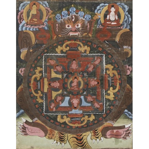 350 - A Tibetan thangka, painted with a Buddhist demonic deity and other figures and motifs, 63cm x 47cm