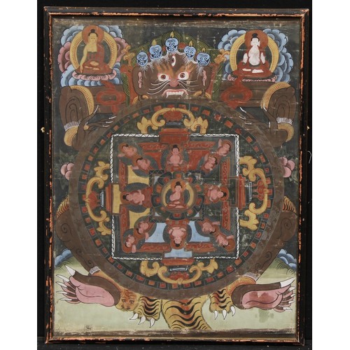 350 - A Tibetan thangka, painted with a Buddhist demonic deity and other figures and motifs, 63cm x 47cm