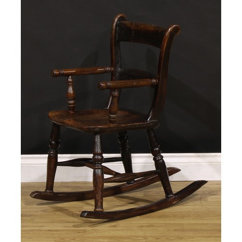 404 - A Victorian vernacular beech and elm child’s bar-back chair, later converted to a rocking chair, 75.... 