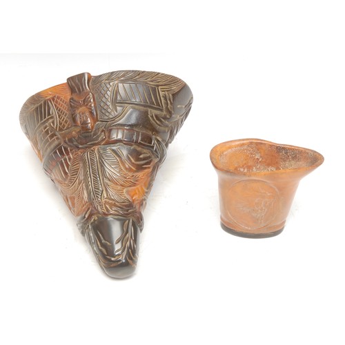 479 - A reproduction moulded and carved resin libation cup, 14cm; another smaller, moulded with a snarling... 