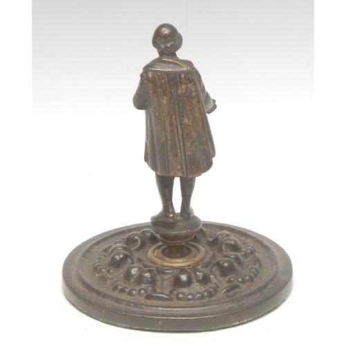 51 - A 19th century patinated bronze desk weight, as William Shakespeare holding a manuscript, mounted on... 