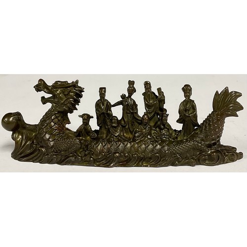 71 - A contemporary Chinese bronze dragon boat, cast with figures seated and standing, 16.5cm wide