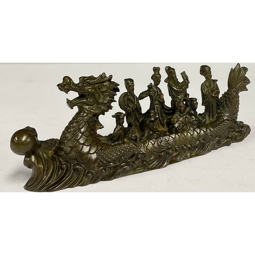 71 - A contemporary Chinese bronze dragon boat, cast with figures seated and standing, 16.5cm wide